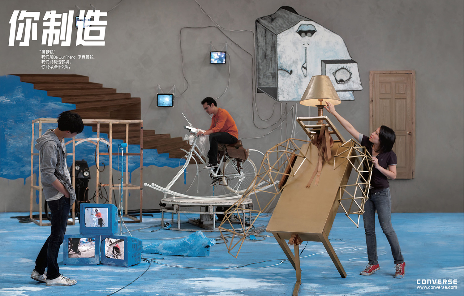Artists building the Dream Catcher installation from found objects