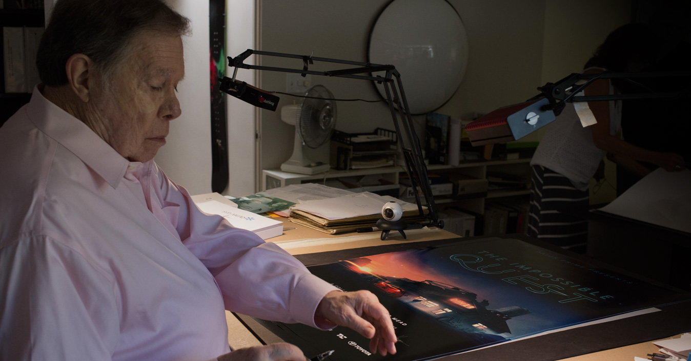 Syd Mead working beside an Impossible Quest illustration